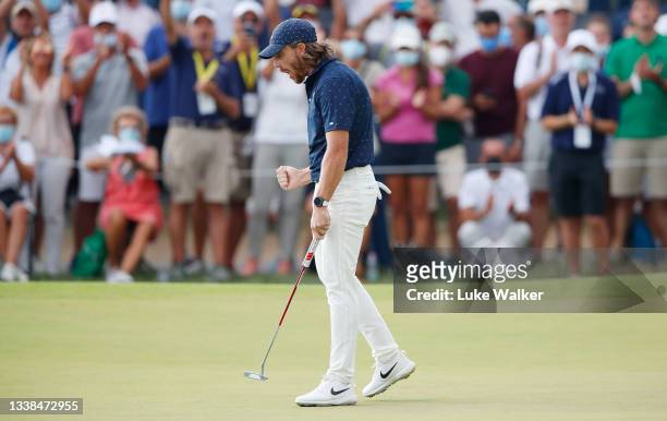 Tommy Fleetwood of England celebrates a birdie putt on the 18th green during Day Four of The Italian Open at Marco Simone Golf Club on September 05,...