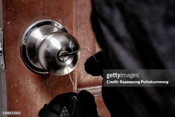 burglar trying to get into a house - bandit stock pictures, royalty-free photos & images