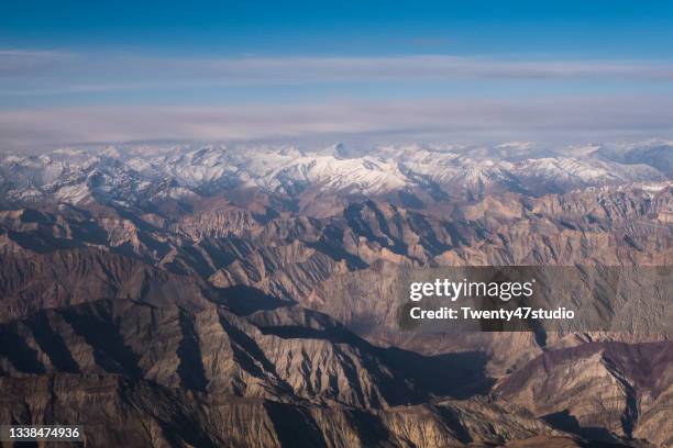 high angle view of snowcapped mountain of india himalayas from airplane - ladakh stock-fotos und bilder