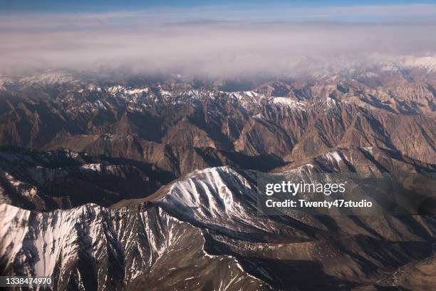 high angle view of snowcapped mountain of india himalayas from airplane - ladakh stock-fotos und bilder