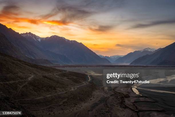 landscape view of nubra valley with confluence of shyok river and nubra river at sunset in ladakh region, india - nubra valley stock pictures, royalty-free photos & images