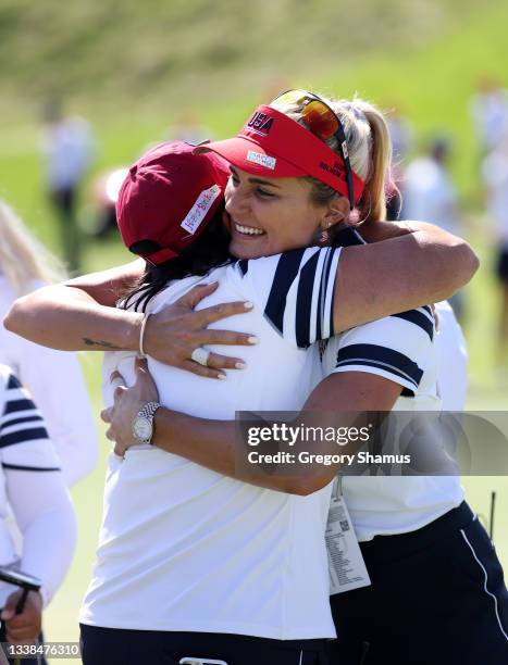 Lexi Thompson of Team USA and USA Captain Patty Hurst react after winning their match during the Foursomes Match on day two of the Solheim Cup at the...