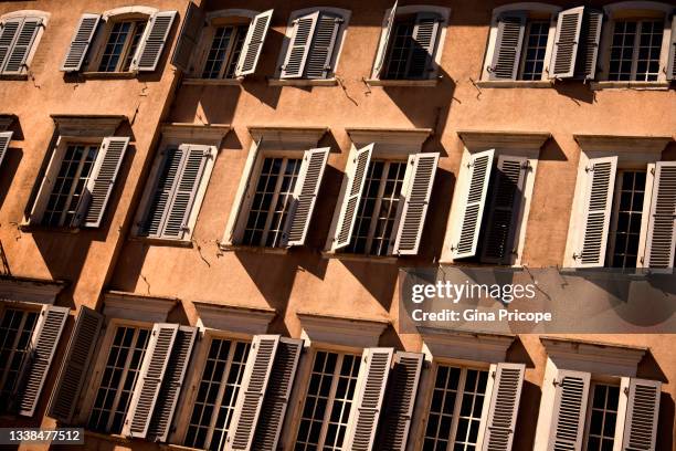 open and closed shutters in sion, switzerland - スイス シオン ストックフォトと画像