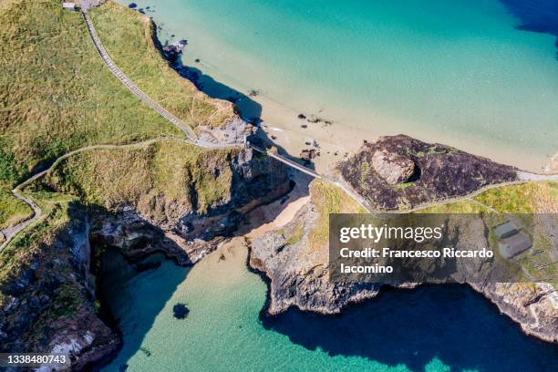 uk, northern ireland, county antrim, ballintoy, carrick-a-rede rope bridge, aerial drone view - northern ireland stock pictures, royalty-free photos & images