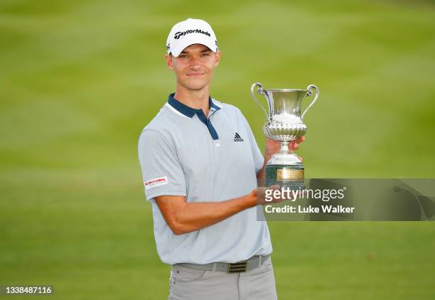 Nicolai Hojgaard of Denmark poses for a photo with the trophy after Day Four of The Italian Open at Marco Simone Golf Club on September 05, 2021 in...
