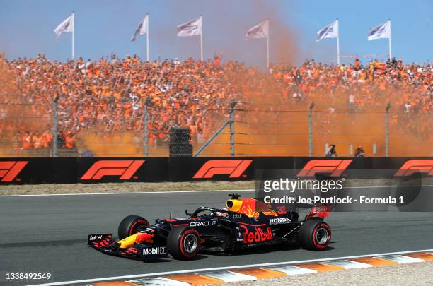 Max Verstappen of the Netherlands driving the Red Bull Racing RB16B Honda on their way to the grid prior to the F1 Grand Prix of The Netherlands at...