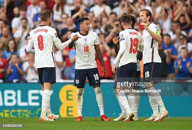 Harry Kane of England celebrates with Jordan Henderson, Jesse Lingard and Mason Mount after scoring their team's second goal from the penalty spot...