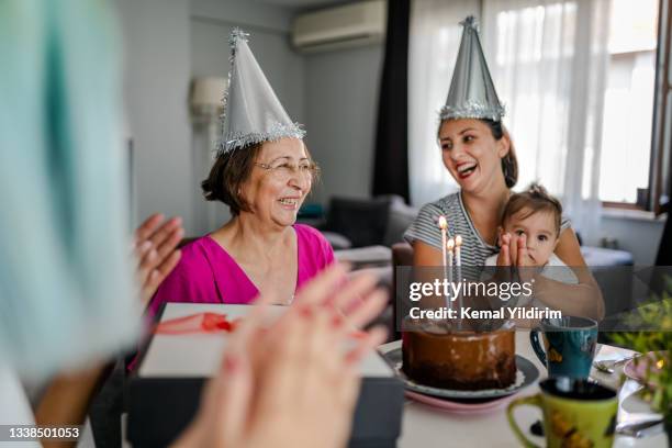 family wishing happy birthday to senior woman - happy birthday canada 個照片及圖片檔