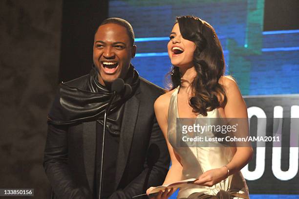 Singer Taio Cruz and singer Selena Gomez onstage at the 2011 American Music Awards held at Nokia Theatre L.A. LIVE on November 20, 2011 in Los...