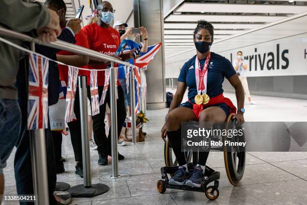 Kadeena Cox, who won Gold in the Women's 500m Time Trial C4-5 and Mixed 750m Team Sprint C1-5 events at the Tokyo 2020 Paralympics, is greeted by...