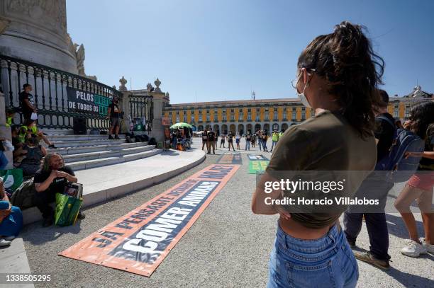 Pro-animal rights activists gather to stage a protest in Praça do Comercio on September 05, 2021 in Lisbon, Portugal. The event has been stages by...