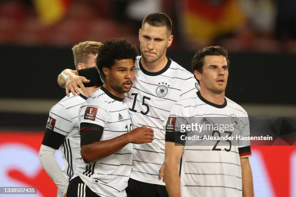 Serge Gnabry of Germany celebrates with Niklas Sule after scoring their team's second goal during the 2022 FIFA World Cup Qualifier match between...