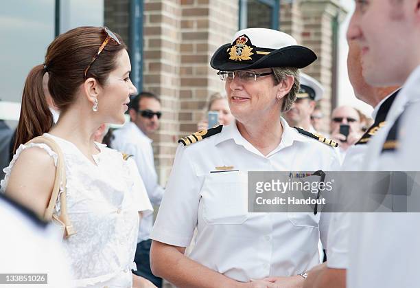 In this handout provided by the Royal Australian Navy, Princess Mary of Denmark speaks with the Commanding Officer of HMAS Kuttabul, Commander...