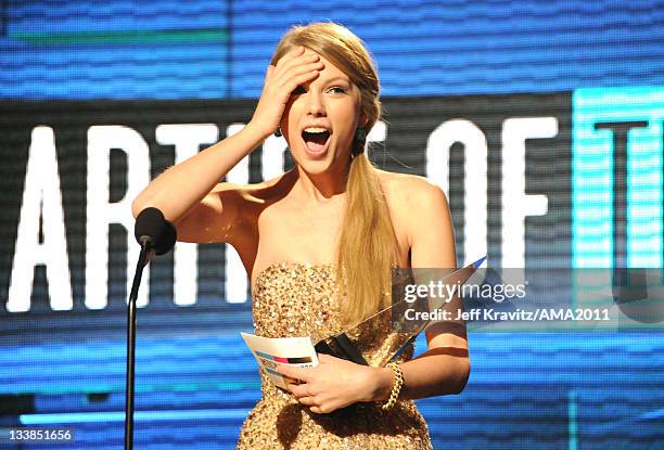 Taylor Swift accepts award onstage at the Nokia Theatre L.A. LIVE on November 20, 2011 in Los Angeles, California.