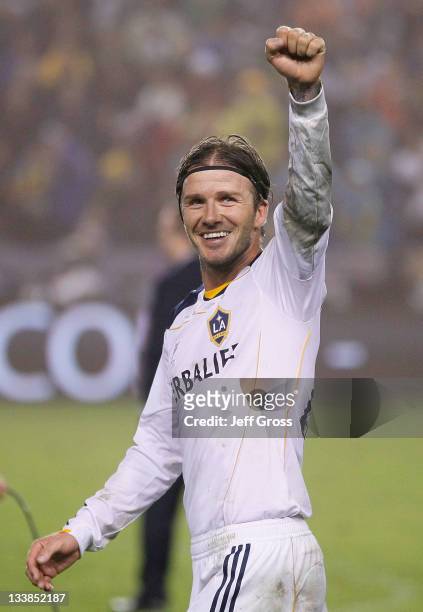 David Beckham of the Los Angeles Galaxy acknowledges the fans after defeating the Houston Dynamo 1-0 to win the 2011 MLS Cup at The Home Depot Center...
