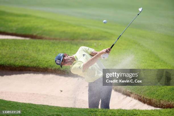 Joaquin Niemann of Chile plays a shot from a bunker on the eighth hole during the final round of the TOUR Championship at East Lake Golf Club on...