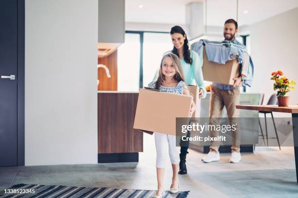 family moving into a new house - box white flat imagens e fotografias de stock