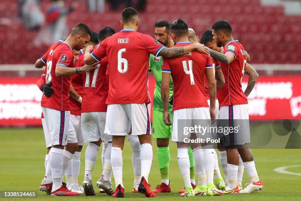 Players of Chile huddle before a match between Ecuador and Chile as part of South American Qualifiers for Qatar 2022 at Rodrigo Paz Delgado Stadium...