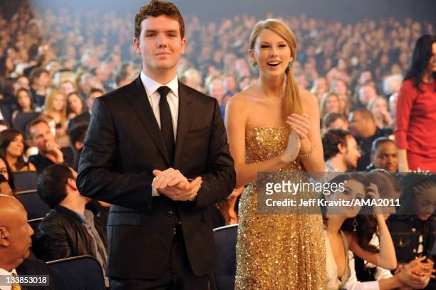 Singer Taylor Swift and Austin Swift attend the 2011 American Music Awards held at Nokia Theatre L.A. LIVE on November 20, 2011 in Los Angeles,...