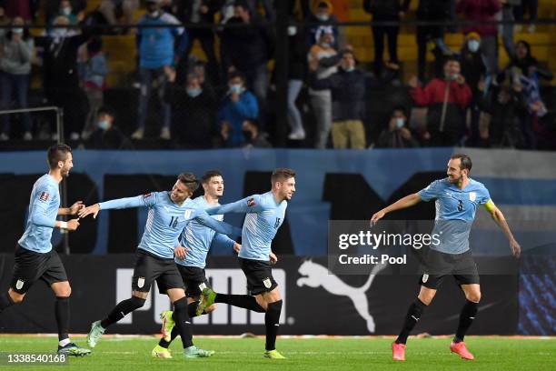 Federico Valverde of Uruguay celebrates with teammates after scoring the second goal of his team during a match between Uruguay and Bolivia as part...