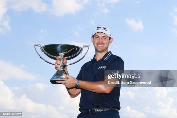 Patrick Cantlay of the United States celebrates with the FedEx Cup after winning during the final round of the TOUR Championship at East Lake Golf...