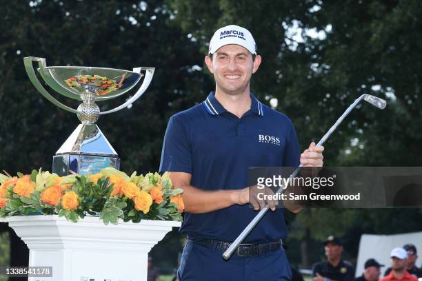 Patrick Cantlay of the United States celebrates with the FedEx Cup and Calamity Jane putter trophy after winning during the final round of the TOUR...