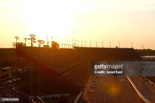 General view of racing as the sun sets during the NASCAR Cup Series Cook Out Southern 500 at Darlington Raceway on September 05, 2021 in Darlington,...