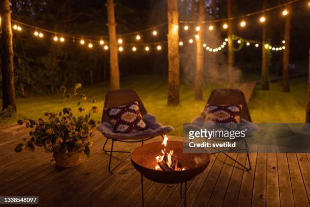 fire pit at cottage - cosy stock pictures, royalty-free photos & images