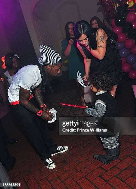 Dewayne "Lil Wayne" Carter and Dewayne Carter III attend Reginae Carter's 13th Birthday party at The Callanwolde Mansion on November 19, 2011 in...