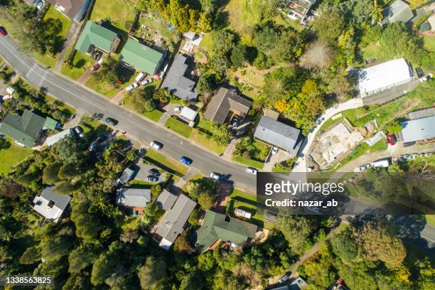 top view of city with cars, houses and greenery. - flying kiwi stock pictures, royalty-free photos & images