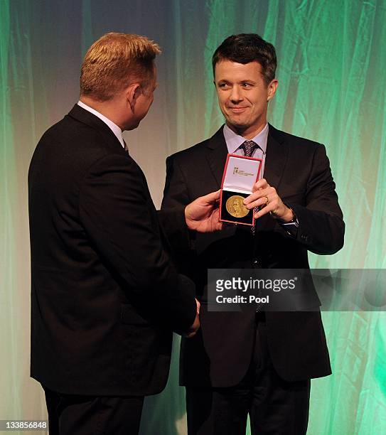 Prince Frederik of Denmark presents the Danish export association's honorary diploma and H.R.H. Prince Henrik's medal of honour to PowerSense CEO...