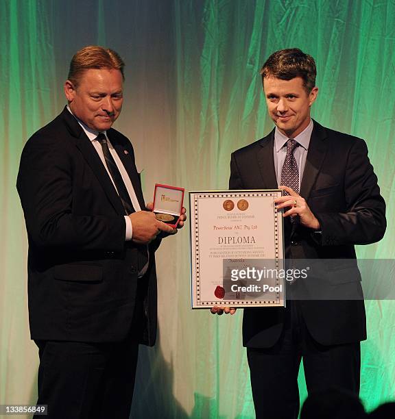 Prince Frederik of Denmark presents the Danish export association's honorary diploma and H.R.H. Prince Henrik's medal of honour to PowerSense CEO...
