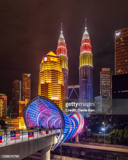 2021 independence day lights up - petronas twin towers and saloma link - petronas towers stock pictures, royalty-free photos & images