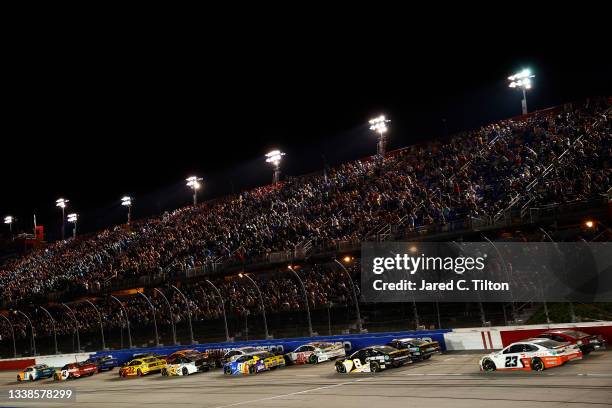 Denny Hamlin, driver of the Offerpad Toyota, leads the field during the NASCAR Cup Series Cook Out Southern 500 at Darlington Raceway on September...