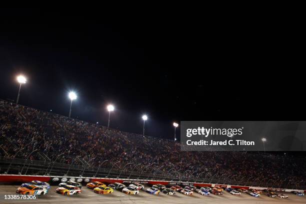 Denny Hamlin, driver of the Offerpad Toyota, leads the field during the NASCAR Cup Series Cook Out Southern 500 at Darlington Raceway on September...