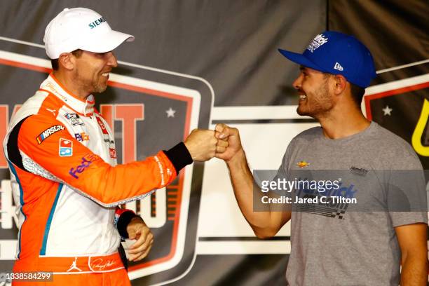 Kyle Larson, driver of the HendrickCars.com Chevrolet, congratulates Denny Hamlin, driver of the Offerpad Toyota, in the Ruoff Mortgage victory lane...