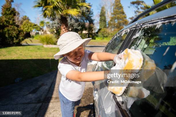 teenage boy washing the car - cleaning sponge stock pictures, royalty-free photos & images