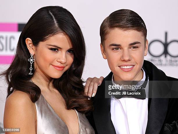 Selena Gomez and Justin Bieber arrive at the 2011 American Music Awards held at Nokia Theatre L.A. LIVE on November 20, 2011 in Los Angeles,...