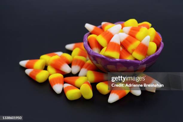 candy corn in bowl - candy corn stock pictures, royalty-free photos & images