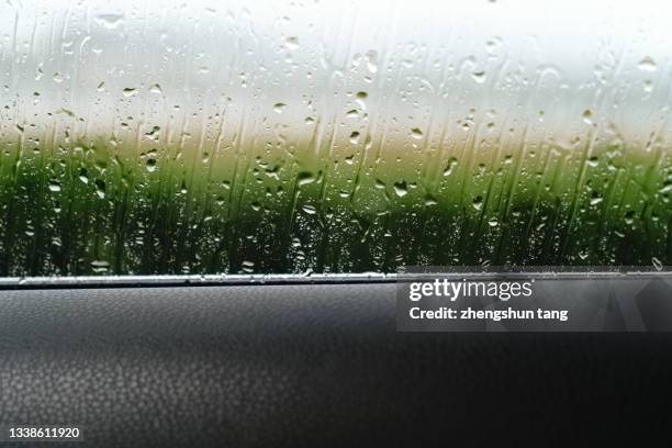 wet glass window in rainy season - monsoon stock pictures, royalty-free photos & images