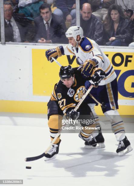 Stephen Leach, Right Wing for the Boston Bruins and Kevin Haller, Defenseman for the Buffalo Sabres in motion on the ice during their NHL Prince of...