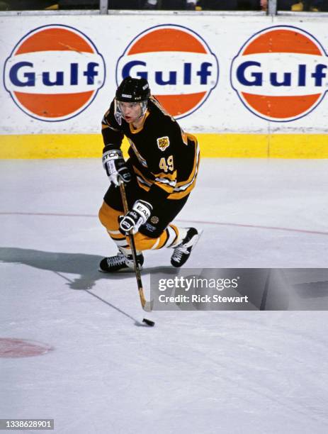 Joe Juneau of Canada and Left Wing for the Boston Bruins in motion on the ice during the NHL Prince of Wales Conference Adams Division game against...