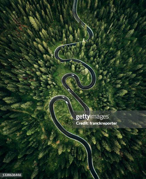 winding road in the dolomites - drone point of view car stock pictures, royalty-free photos & images