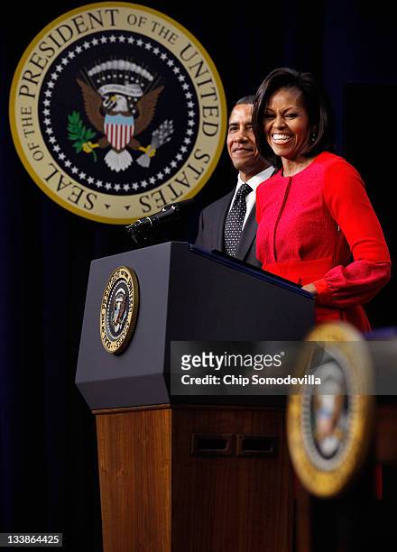 First lady Michelle Obama delivers remarks before President Barack Obama signs legislation into law that will provide business tax credits to help...