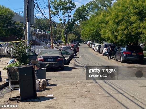 Street with flooded cars drying out after Hurricanee Ida, Flushing, Queens, New York.