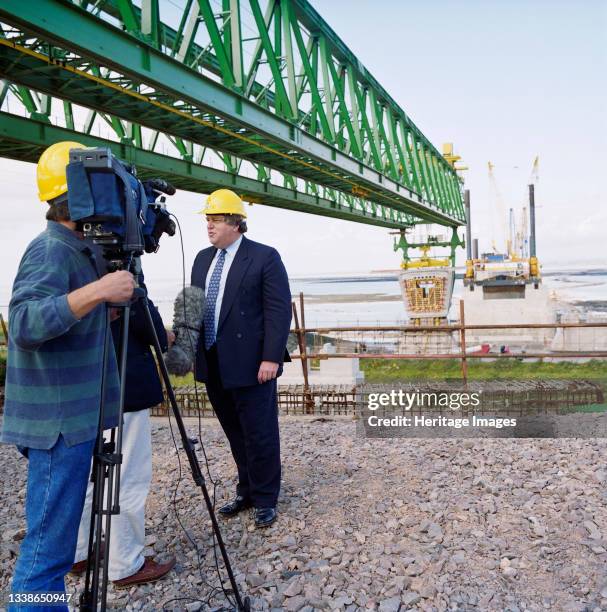 Robert Key, Transport Minister, being interviewed on camera while visiting the Second Severn Crossing construction site during the installation of...