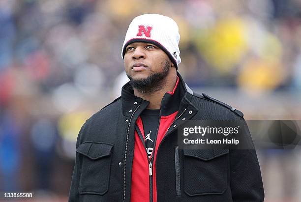 Former Nebraska and current Detroit Lions player Ndamukong Suh watch the action from the sidelines during the game at Michigan Stadium on November...