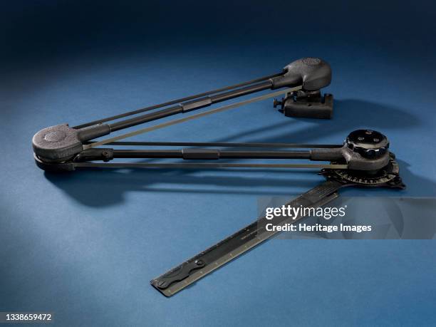 Black metal navigation tool with two protractor arms and ruler. Artist Unknown.