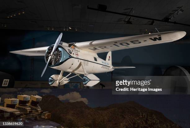 High wing cantilevered monoplane with monocoque fuselage, fixed landing gear, ground adjustable propeller. Flying this specially modified Lockheed 5C...