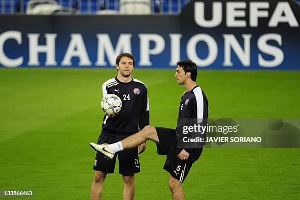 Dinamo Zagreb's Domagoj Vida and Dinamo Zagreb's argentinian Adrian Calello take part in a traininig session at the Santiago Bernabeu stadium in...